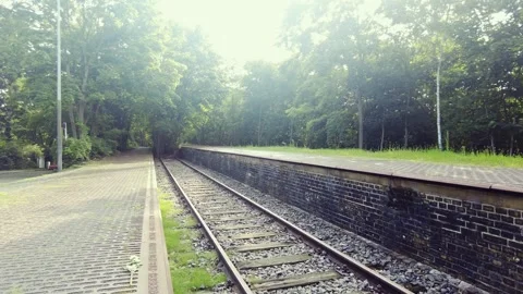 Walking Forward Along Historic Railway Platform With Brick Retaining Wall Stock Footage 345700749