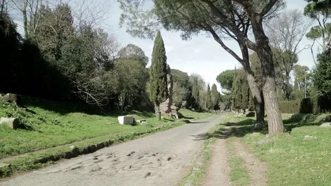 Walking forward on an ancient Roman road in Spring from below Stock Footage 73983341