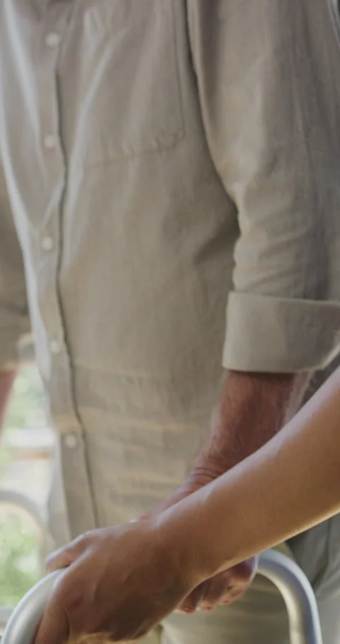 Walking, frame and nurse with support for person in clinic, rehabilitation or Stock Footage 335111917