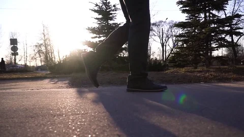 Walking in front of the sun, close up Stock Footage 106327698