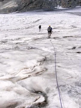 Walking on a glacier/ice in the mountains Stock Photos
