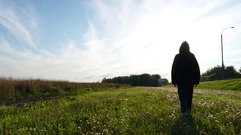 Walking on the Grass Along the Road Video stock 287034967