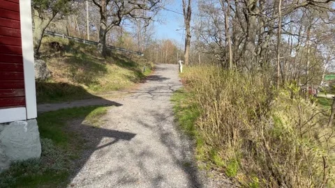 Walking at a graveled path. Stock Footage 250657934