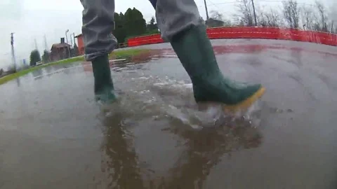 Walking with green rubber boots Video stock 69138436