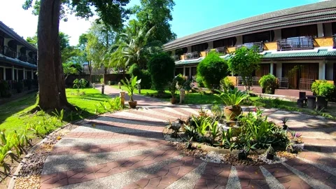 Walking on the Grounds of Beautiful Resort. 스톡 동영상 130404394