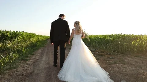 Walking Hand in Hand Down a Dirt Road Stock-Footage 114892349