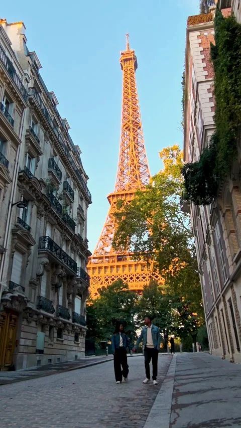 Walking hand in hand under the Eiffel Tower in beautiful Paris, France Stock Footage 347503222