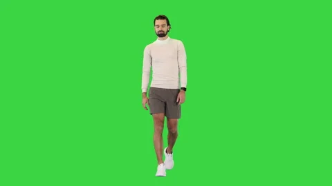 Walking handsome guy in motion on a Green Screen, Chroma Key. 스톡 동영상 157079282