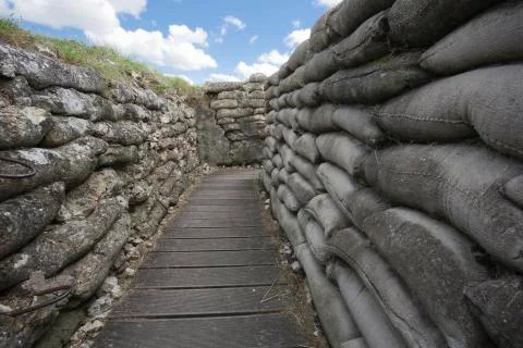 Walking head down through the trenches of death. Stock Photos