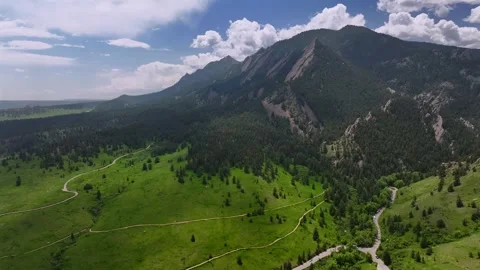 Walking hiking trail spring summer morning blue sky clouds Flatirons Chautauqua Stock Footage 316389761