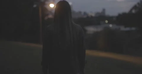 Walking on hill with city behind Stock Footage 140978041