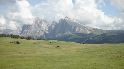 Walking on hilly meadows of Seiser Alm, Dolomites, Italy Stockbeeldmateriaal 150402465