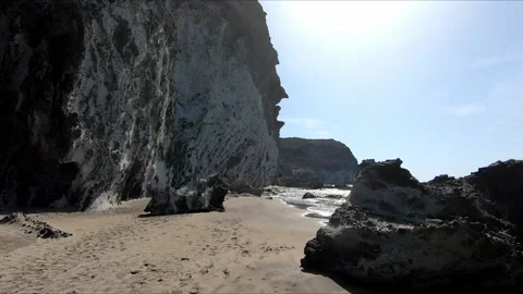 Walking a idyllic beach down a spectacular cliff Stock Footage 279178355