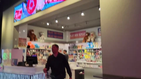 Walking Inside of Arcade Dave and Busters Prize Redemption Stock Footage 243549282