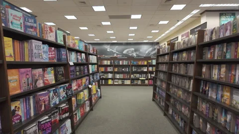 Walking inside bookstore along bookcases filled with books.Pensacola, FL, USA. Stock Footage 279147218