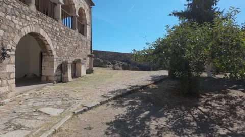 Walking inside a fortified monastery with ancient walls and ruins 스톡 동영상 347273049