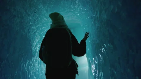 Walking Inside a Glacier: Girl Exploring Jungfraujoch’s Ice Wonderland Stock Footage 287382456