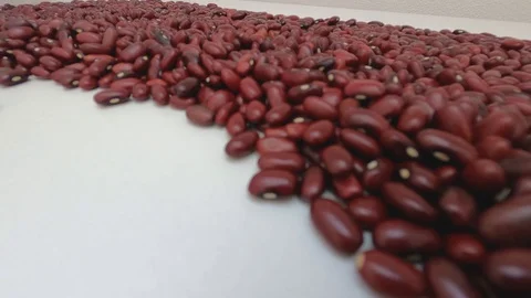 Walking inside raw red beans. Close up, detail, pov, selective focus. Stock Footage 128845649