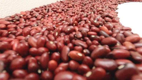 Walking inside raw red beans. Close up, detail, pov, selective focus. Stock Footage 128845721