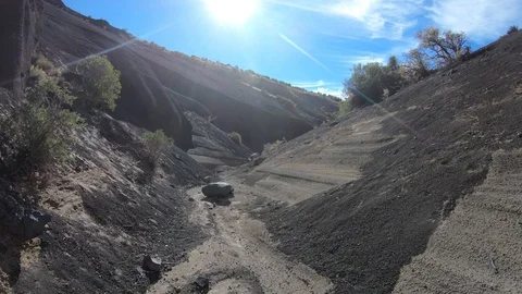 Walking inside volcano malacara grey debris, dry river of vocanic depositions 스톡 동영상 97186928