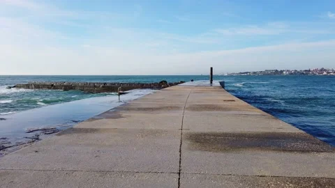 Walking in a jetty with waves crashing Stock Footage 177375739