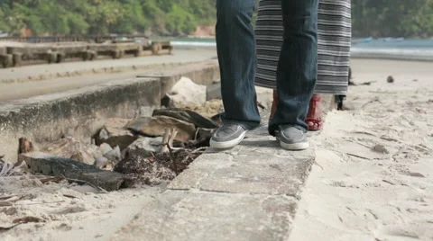 Walking on ledge on beach forward 스톡 동영상 55692758