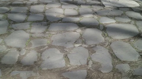Walking from left to right on an ancient Roman road, from above Stock Footage 73983306