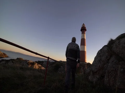 Walking to the lighthouse. 4k Stock Footage 77973856