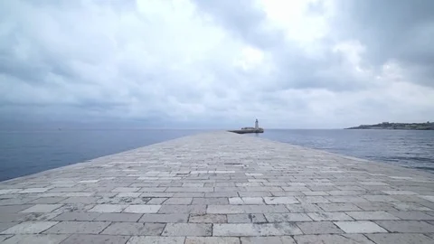 Walking to the lighthouse Stock Footage 77473520