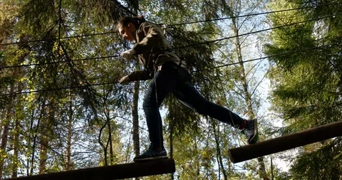 Walking on logs in the Climbing park "Nut" Stock Footage 88996752