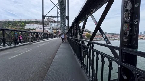 Walking on the lower level roadway of the Dom Luis I Bridge In Porto, Portugal Stock Footage 318211418