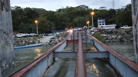 Walking on a makeshift iron pier structure Stock Footage 111611312