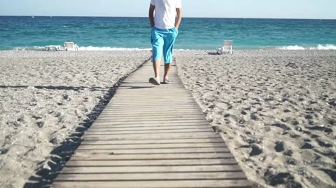 Walking man beach in pier Stock Footage 68892632