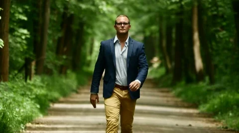 Walking man facing camera. confidence. career progress. success. male person Video stock 64800958