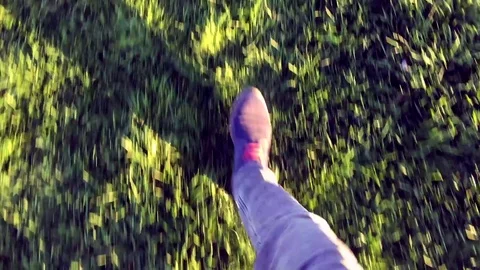 Walking man on grass Stock Footage 76953405