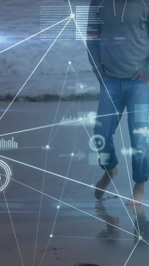 Walking man leaving footprints barefoot on wet sand, wearing hoodie and rolled Video stock 331168630