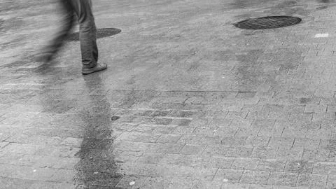 Walking man in the rain Stock Photos