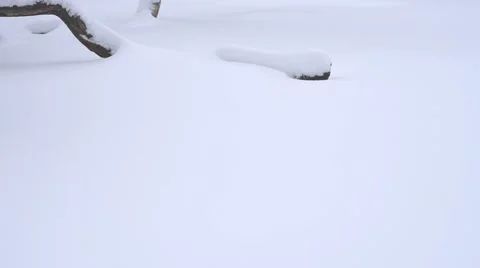 Walking man with steps in snow Stock Footage 58774059