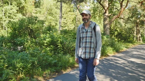 Walking mature man Stock Footage 100826941