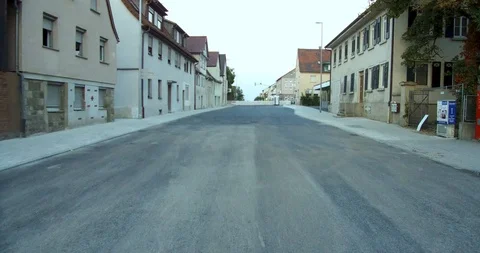 Walking in the middle of the road small town Stock Footage 100677870