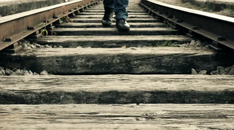 Walking in the middle of the train railway Stock Footage 54105393