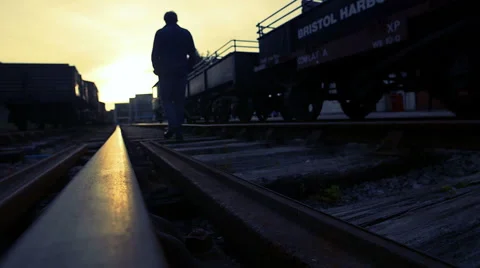 Walking in the middle of the train tracks at sunset Stock-Footage 54070038