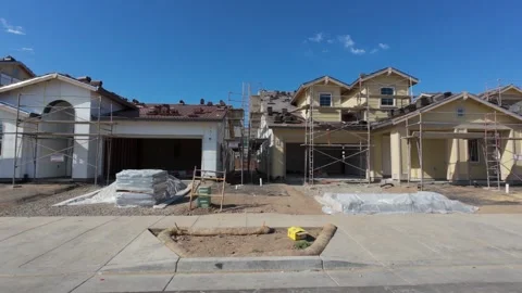Walking by new homes under construction in California Stock Footage 289579958