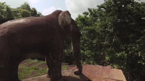 Walking next to Ankor Temple in cambodia, Elephant made out of rock, antique Stock-Footage 145298970