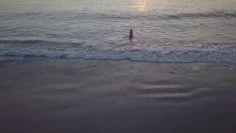 Walking into the Ocean at Sunset 스톡 동영상 83899770