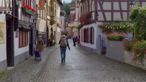 Walking into an old town medieval cobblestone street in slow motion Stock-Footage 303670093