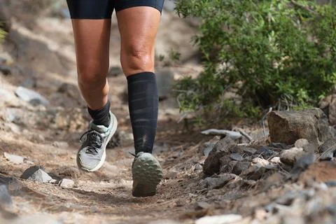 Walking or running exercise legs on rocky footpath Stock Photos