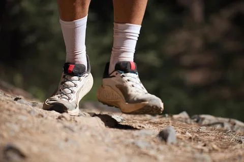 Walking or running exercise legs on rocky footpath Stock Photos