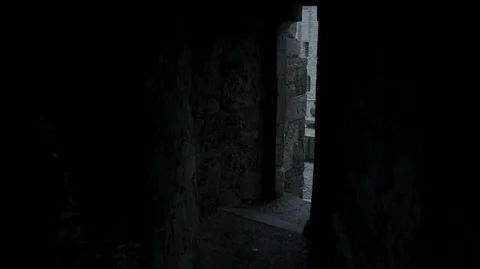 Walking out of the dark into the light of a medieval Castle Stock-Footage 128669521
