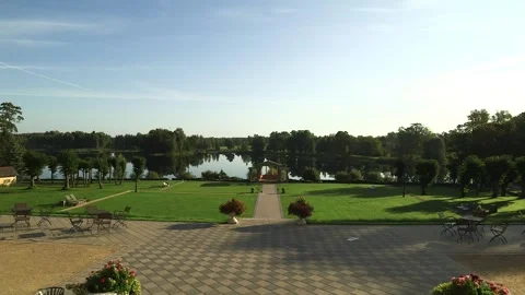 Walking Out from the Palace to the Terrace with a View of Park, Gazebo and Lake Stock Footage 265129397